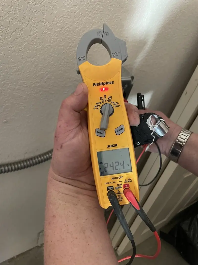 Voltage testing with clamp meter during Recessed Lighting Installation in Woodlake